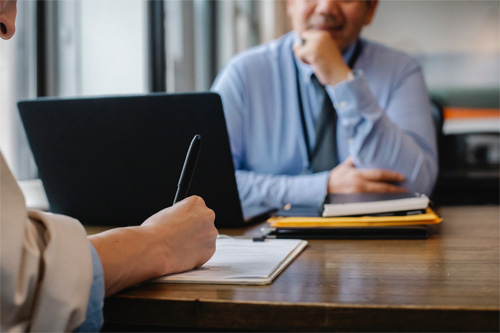 People in an office with laptop